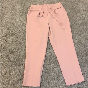 High waisted pink slacks/dress pants.